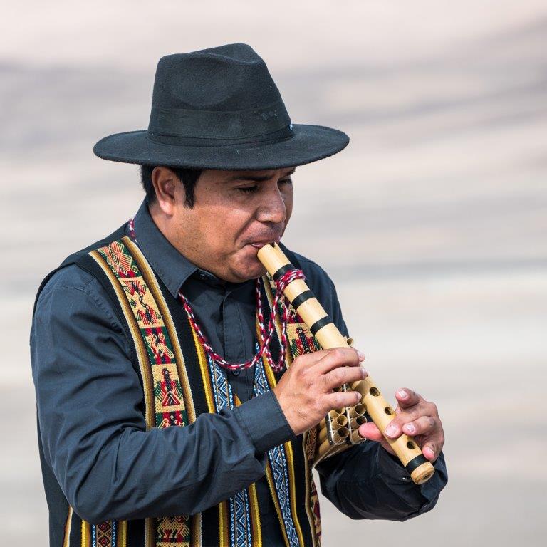 Flutist in Arica, Chile by Deb Thurlbeck