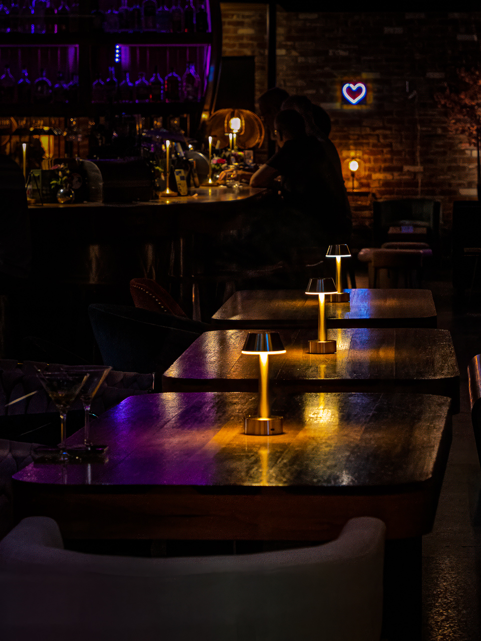 Table lamps in a bar by Tom Lee